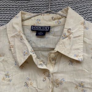 Lands end short sleeved yellow button down. It looks wrinkly but it’s super cute